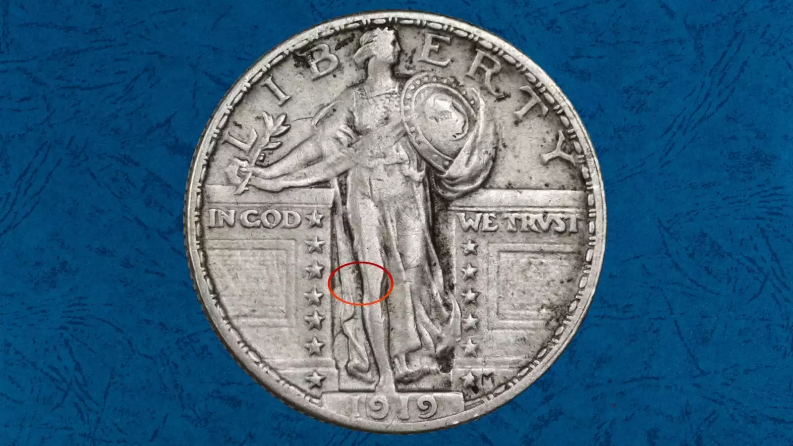 1919 Standing Liberty Quarter die clash error — faint reversed E impression visible in field near Liberty's lower leg